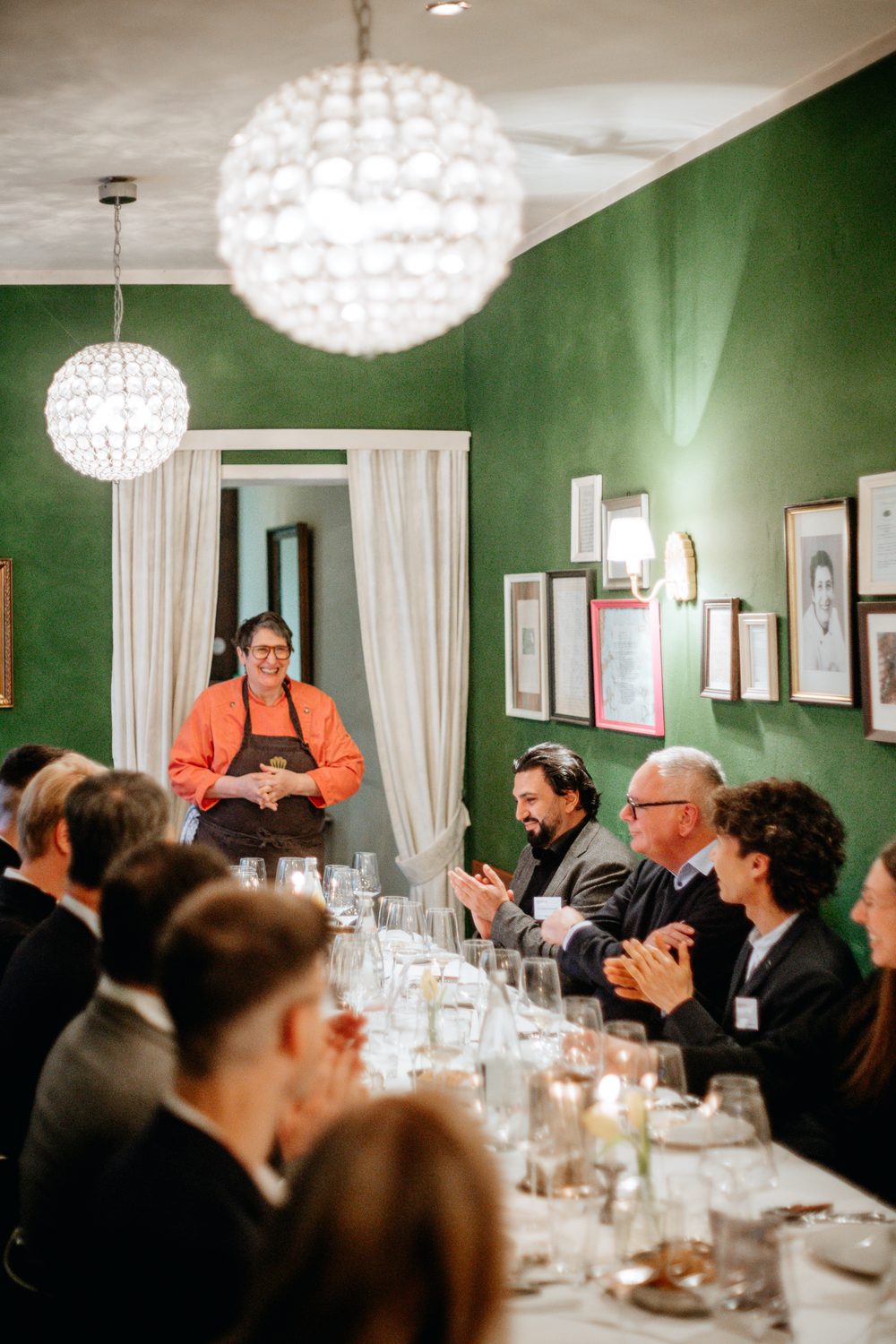 Sommelier pouring white wine at dining event