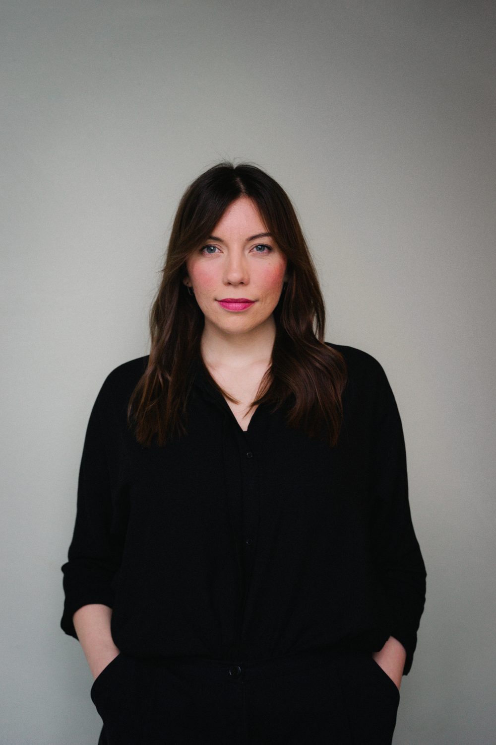 Editorial portrait of entrepreneur in light-filled space